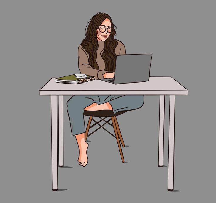 This may contain: a woman sitting at a table with a laptop computer in front of her on her lap