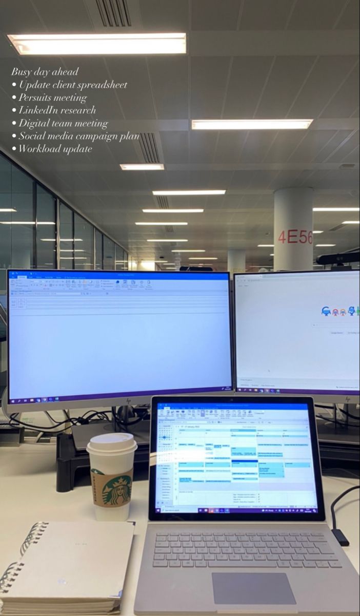 This may contain: an open laptop computer sitting on top of a desk next to a monitor and keyboard